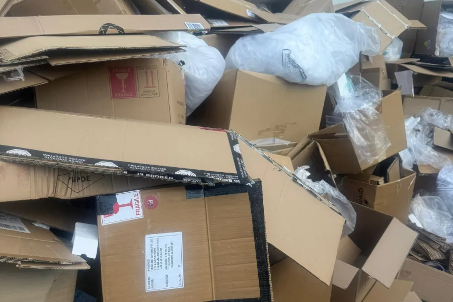 Cardboard boxes and household items awaiting pickup