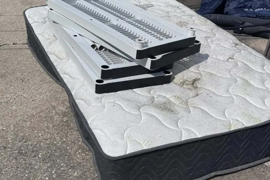 Mattress and bed components awaiting removal